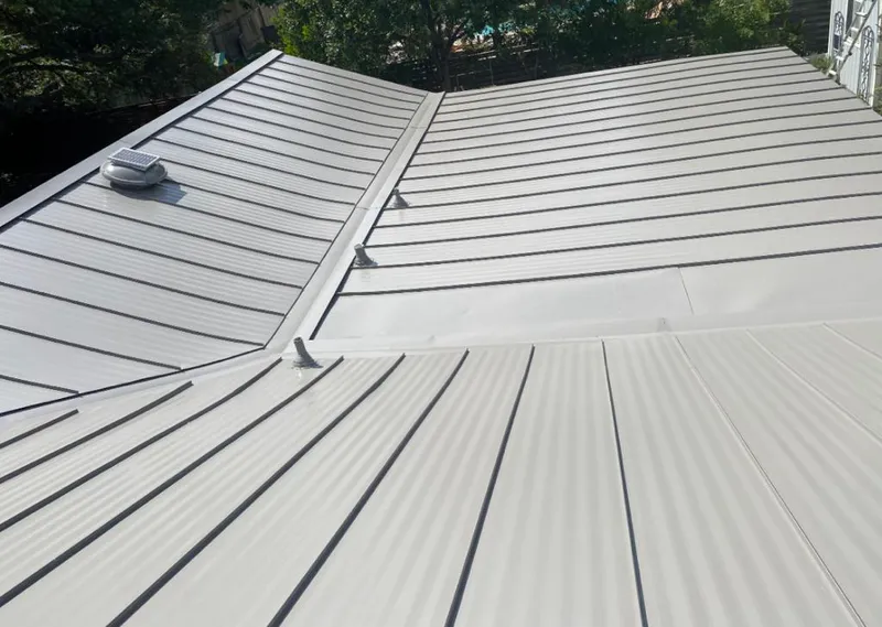 Solar attic fan installed on a metal roof for Roof Ventilation in Memphis